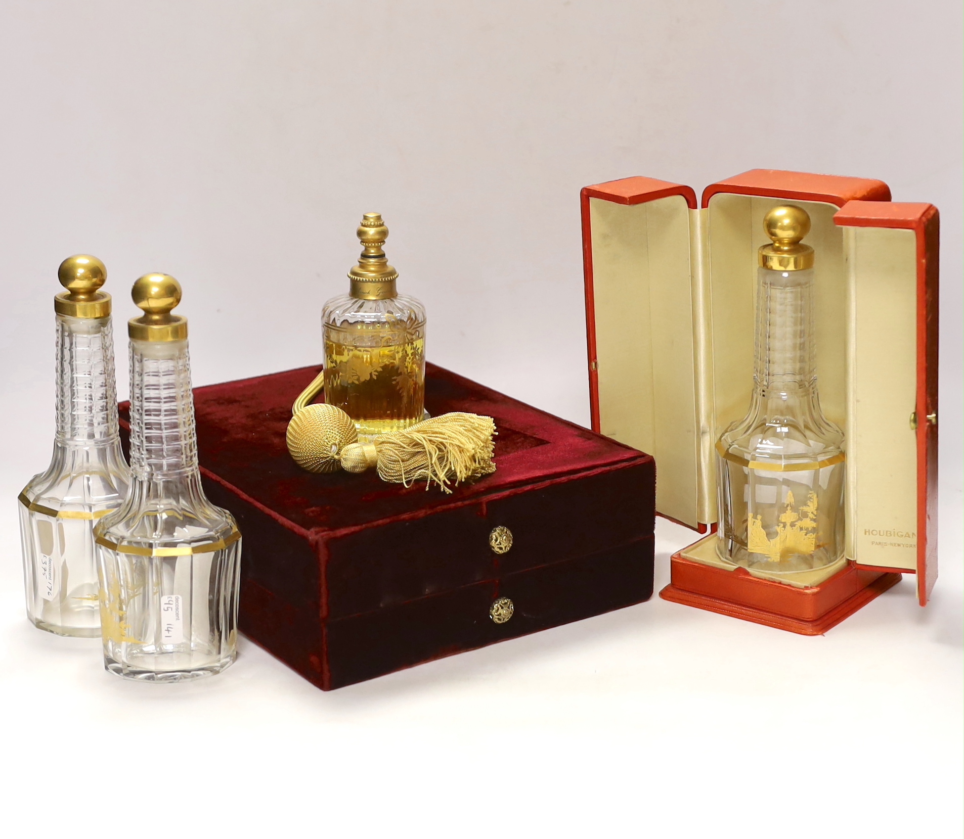 An Annick Gontal, Paris Baccarat perfume atomiser, boxed, together with three Houbigant perfume gilt decorated Baccarat bottles, one with two door peach leather case, tallest Houbigan perfume bottle, 20cm high including
